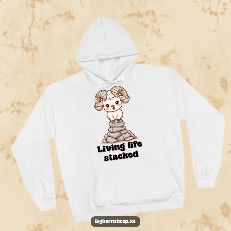 Funny, happy bighorn sheep character concentrating on balancing a stack of pebbles on a cozy hoodie, symbolizing peaceful effort.
