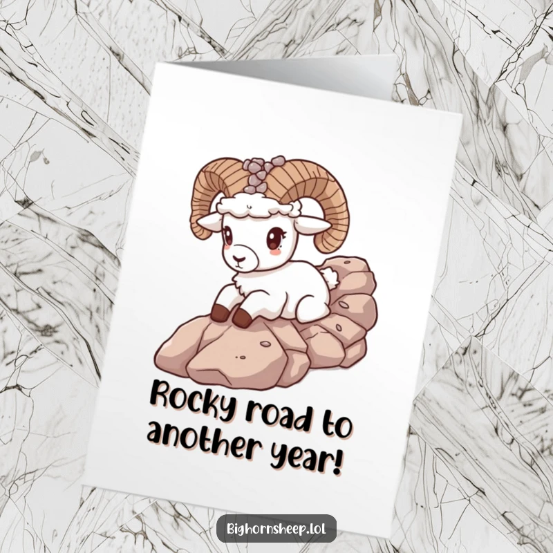 Funny free printable birthday card shows a bighorn sheep with a pebble crown joyfully sliding down a rocky slope.